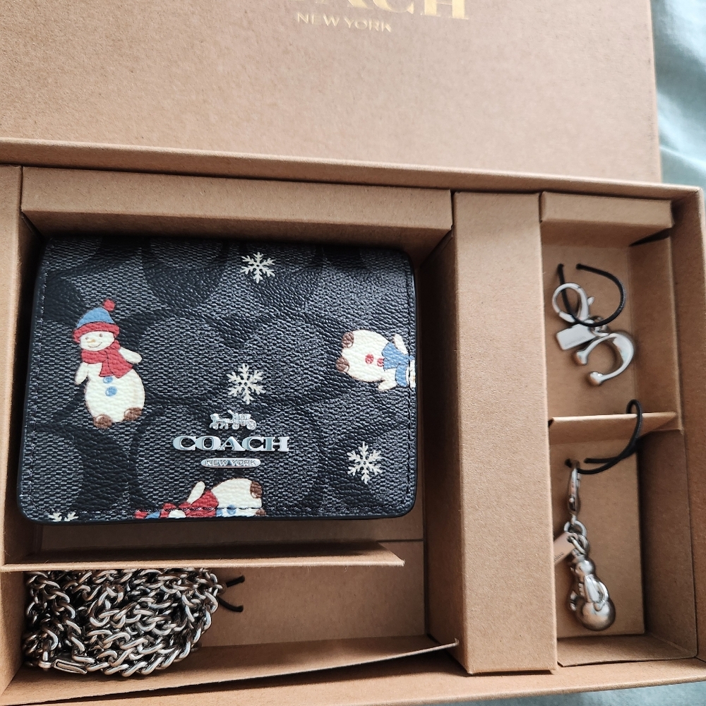 COACH. NWT. Boxed snowman wallet with chain